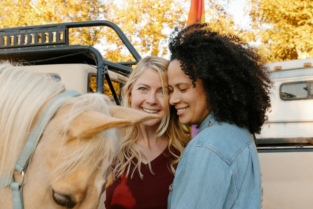 two women embracing outdoors