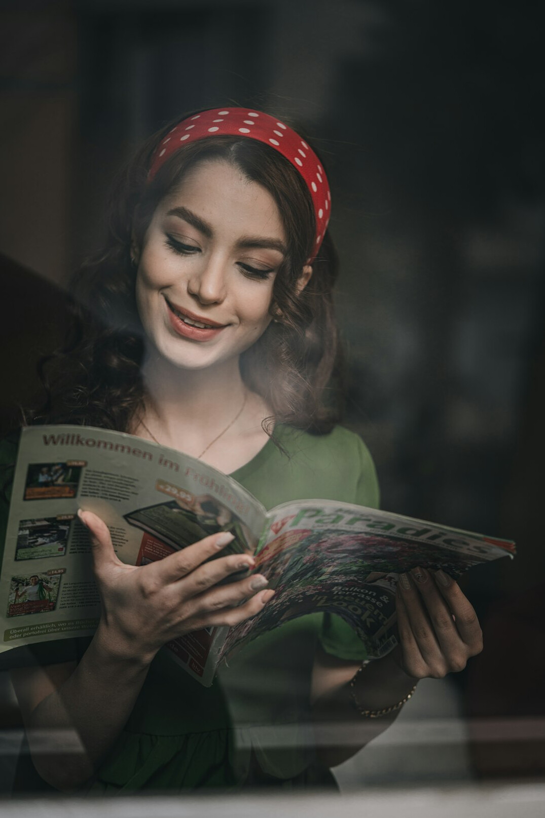 woman reading gossip magazine