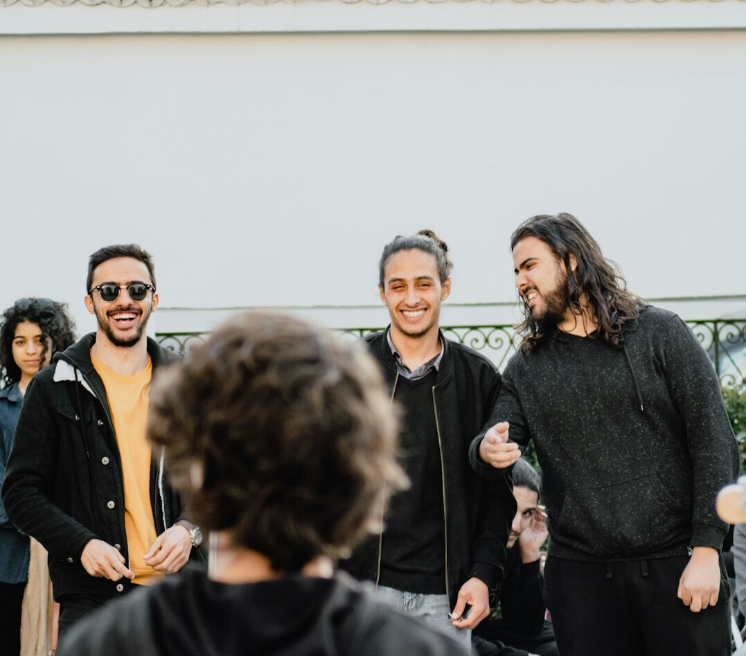 group of celebrities laughing together