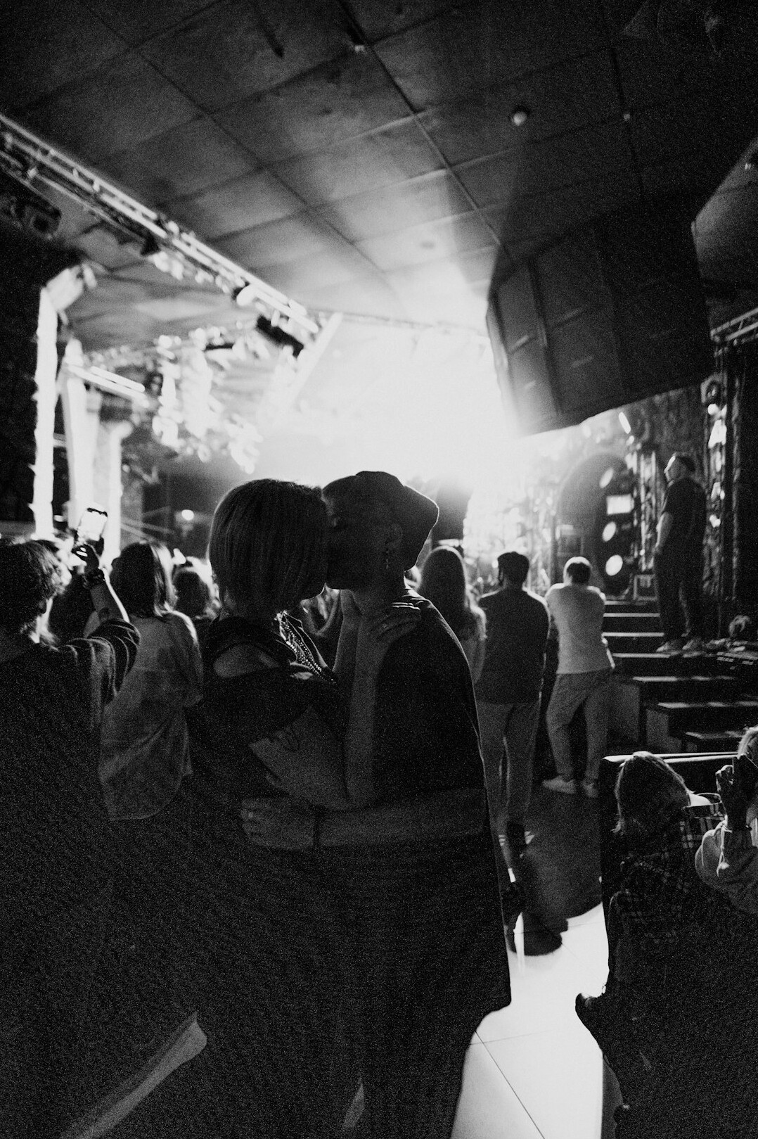 celebrity couple hugging on stage