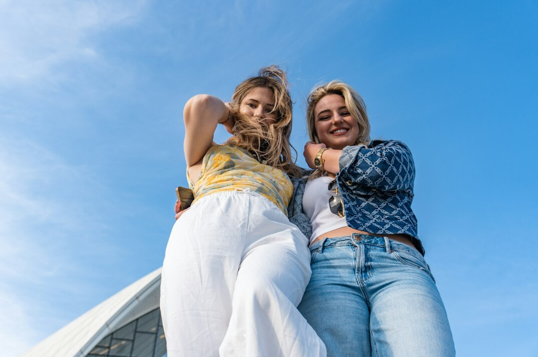 celebrity friends embracing outdoors